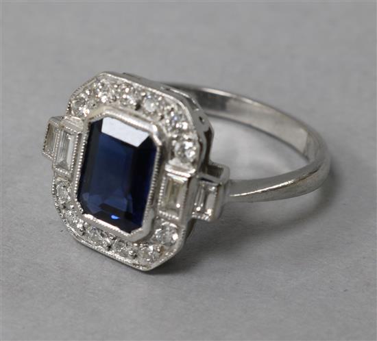 A modern Art Deco style 18ct white gold, sapphire and diamond cluster octagonal ring, size M.